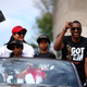 Toronto Raptors President Masai Ujiri and family wave to the crowd during the Toronto Raptors Victory Parade on June 17, 2019 in Toronto, Canada.